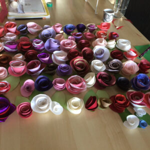 Handmade paper roses and leaves, an example of Abigail Baird cut-paper keepsakes